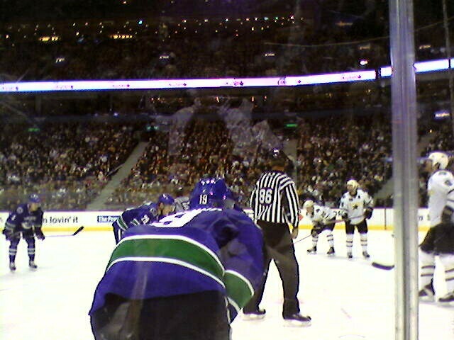 The Canucks line up for a faceoff.